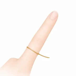 Paper strip wrapped around the finger base to measure ring size at home